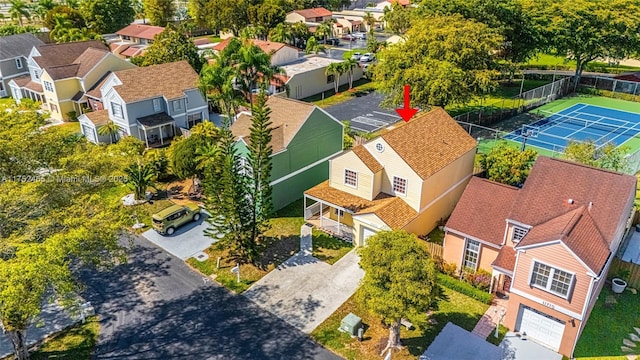 birds eye view of property with a residential view