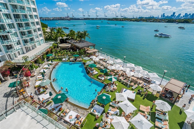 birds eye view of property featuring a water view and a view of city