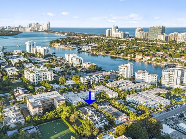 birds eye view of property featuring a view of city and a water view