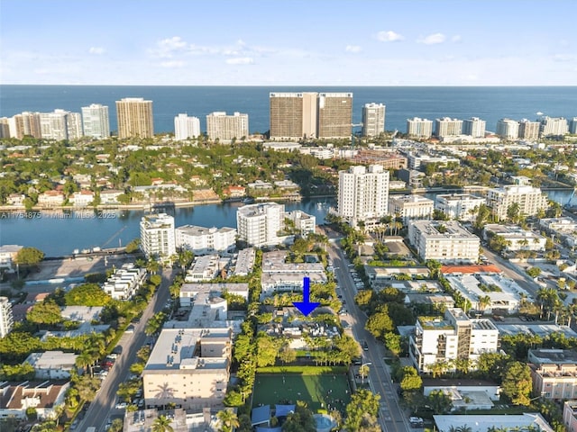 birds eye view of property with a water view and a city view