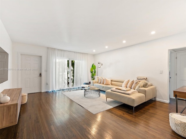 living room featuring baseboards, dark wood-style flooring, and recessed lighting