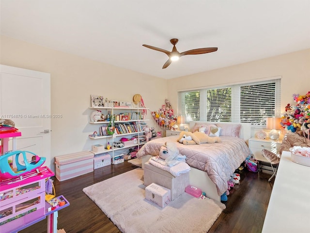 bedroom featuring wood finished floors and a ceiling fan