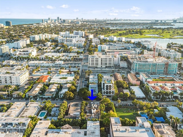 drone / aerial view with a view of city and a water view