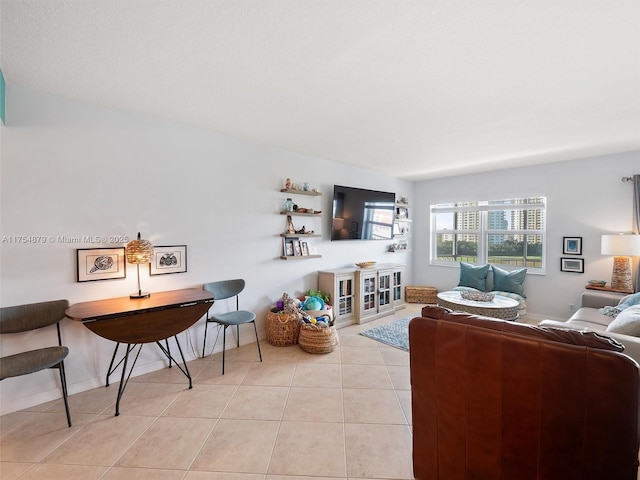 living area with tile patterned flooring