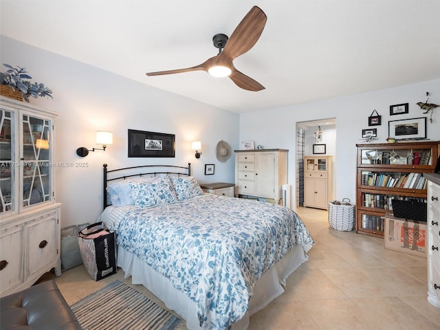 bedroom featuring light tile patterned floors and ceiling fan