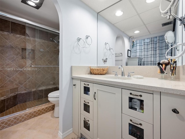 bathroom featuring visible vents, toilet, tile patterned floors, vanity, and a shower stall