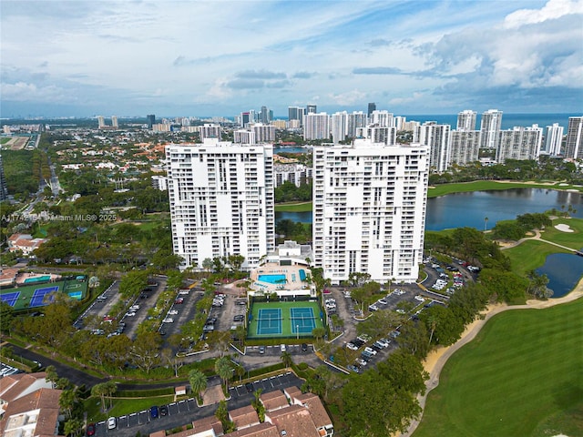 aerial view featuring a view of city, a water view, and golf course view
