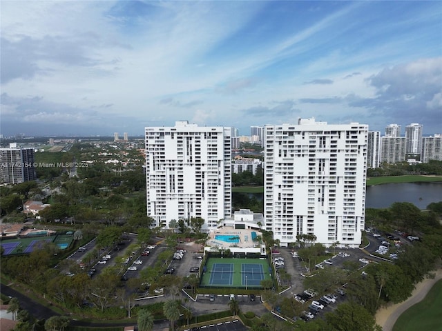 drone / aerial view featuring a water view and a city view