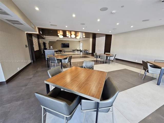 dining room with recessed lighting, visible vents, and baseboards