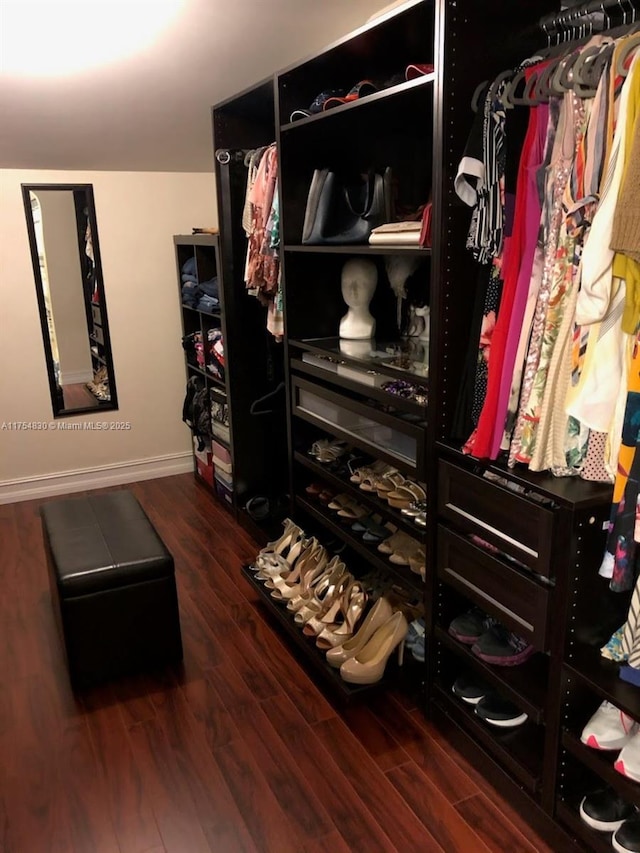 spacious closet with wood finished floors