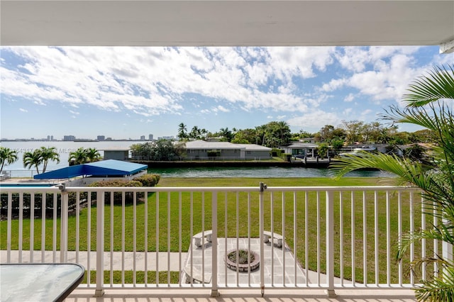 exterior space with a water view and a balcony