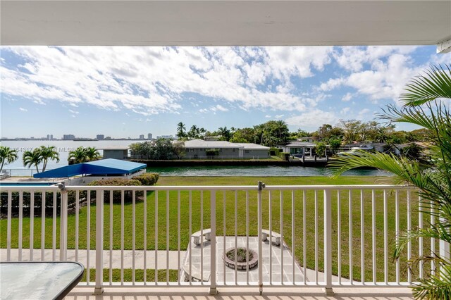 1700 NE 105th St Unit 216, Miami Shores, FL 33138 - view of green lawn featuring a water view