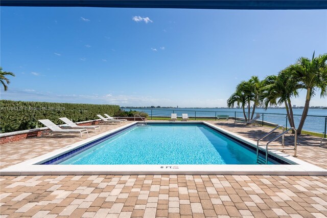 1700 NE 105th St Unit 216, Miami Shores, FL 33138 - community pool featuring a patio and a water view