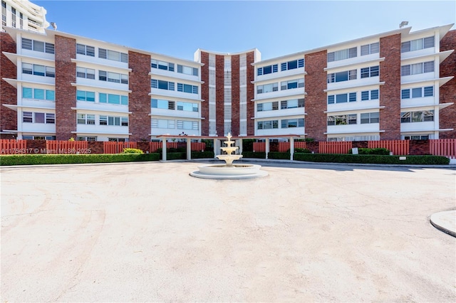 view of building exterior featuring fence