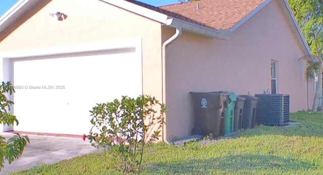 view of home's exterior with cooling unit, a lawn, an attached garage, and stucco siding