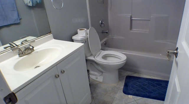 bathroom featuring tile patterned flooring, shower / bath combination, vanity, and toilet