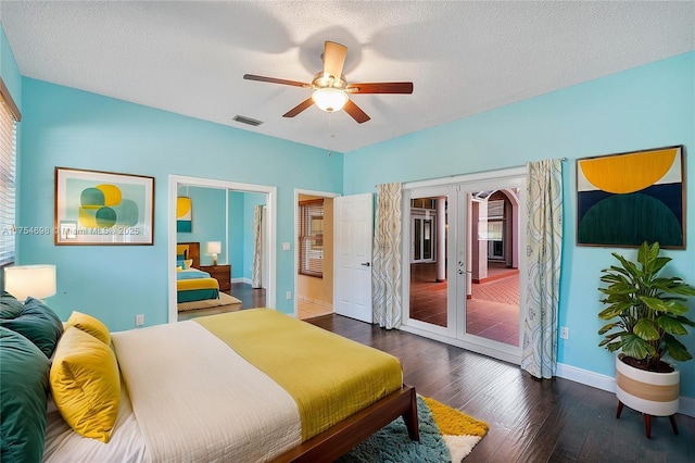 bedroom featuring access to exterior, french doors, visible vents, a textured ceiling, and hardwood / wood-style flooring