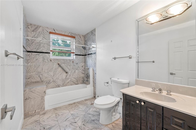 full bath featuring marble finish floor, bathtub / shower combination, vanity, and toilet