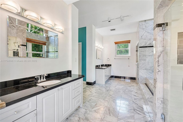 full bathroom featuring marble finish floor, two vanities, a sink, and visible vents