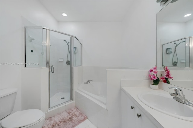 full bath with a garden tub, a shower stall, toilet, and vanity