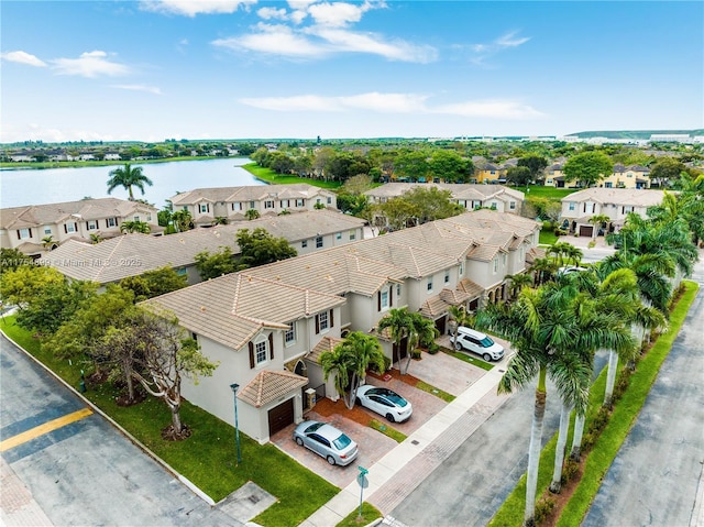 bird's eye view featuring a water view and a residential view