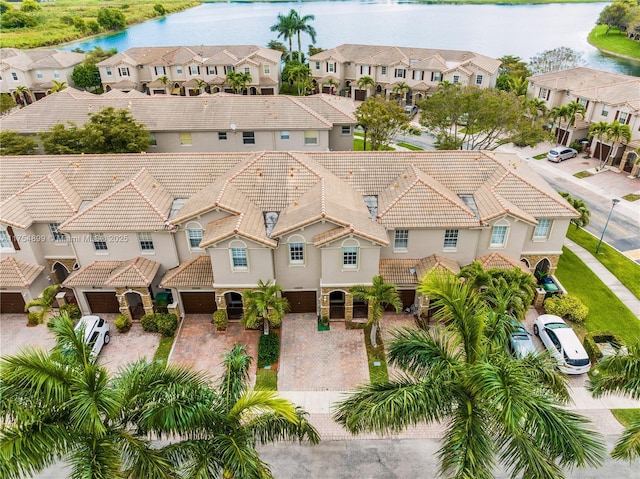 birds eye view of property featuring a water view and a residential view