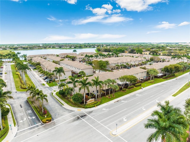 bird's eye view featuring a water view and a residential view