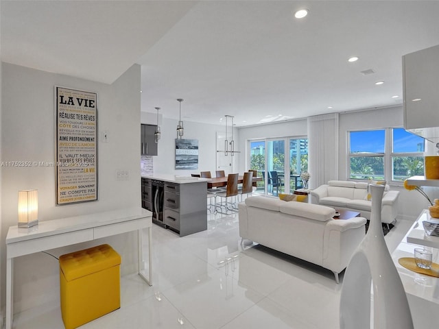 living area featuring recessed lighting and beverage cooler