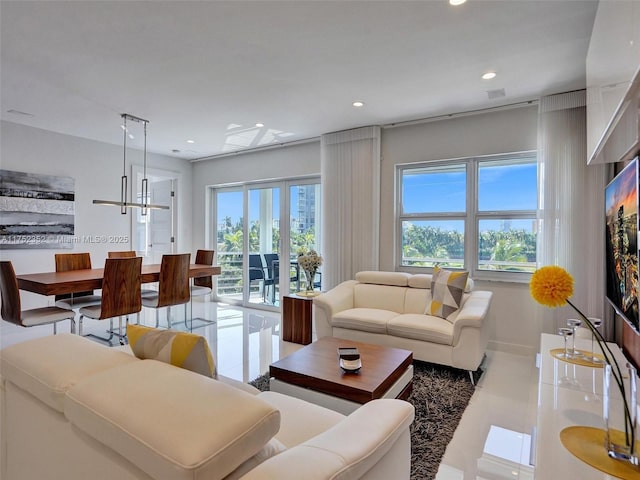 living room featuring recessed lighting and baseboards