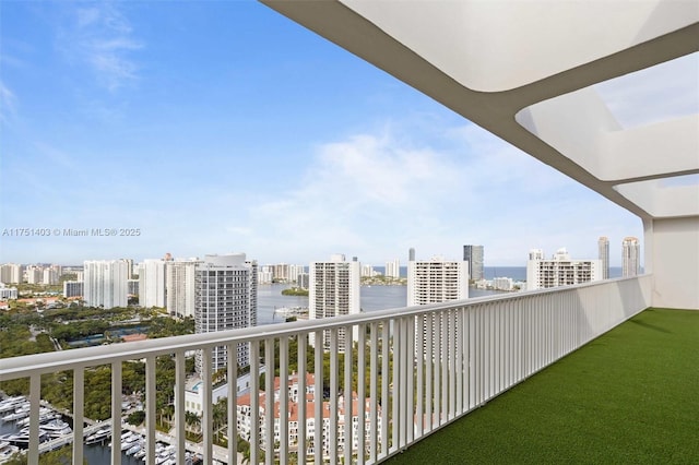 balcony with a water view and a city view