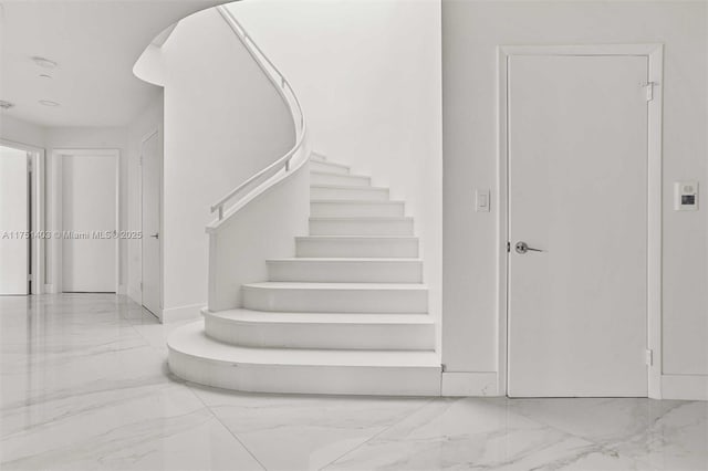 stairs with marble finish floor