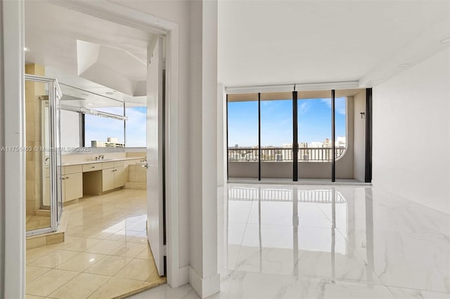 interior space featuring a wall of windows and marble finish floor