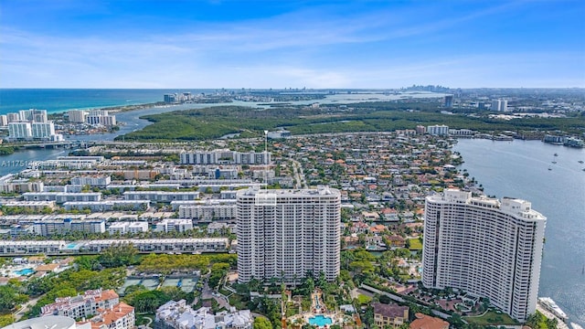 birds eye view of property featuring a water view and a city view