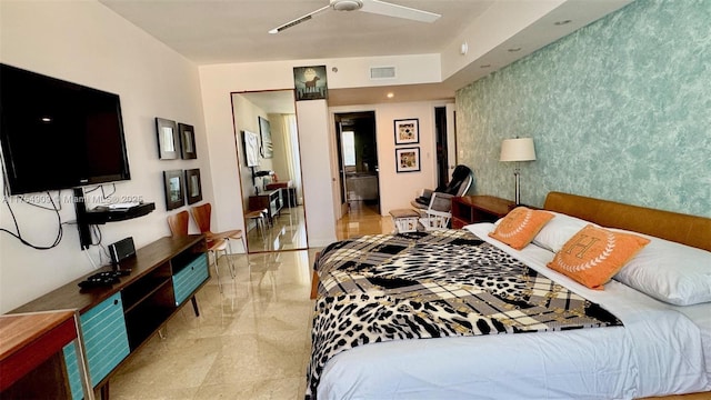 bedroom with wallpapered walls, an accent wall, a ceiling fan, and visible vents