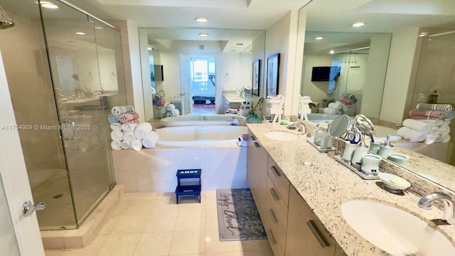 bathroom featuring a sink and a stall shower