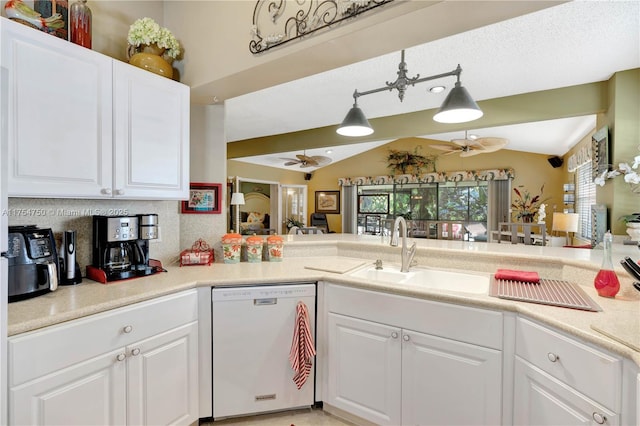 kitchen with white dishwasher, a sink, a ceiling fan, and white cabinets