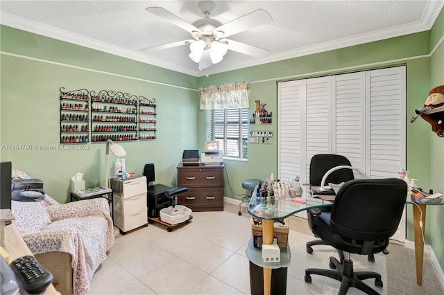 office area with ceiling fan, a textured ceiling, baseboards, and light tile patterned floors