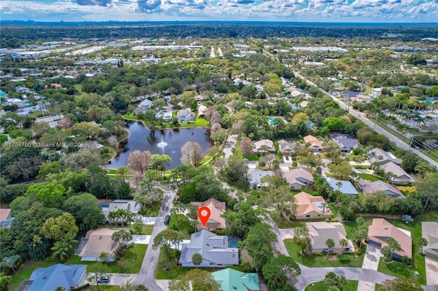 drone / aerial view featuring a water view and a residential view