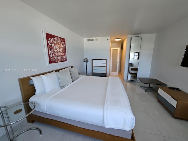 bedroom with visible vents and light tile patterned flooring