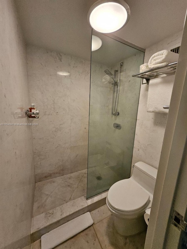 full bathroom with tile patterned flooring, walk in shower, and toilet