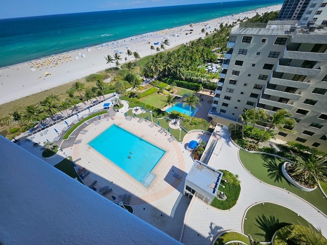 birds eye view of property featuring a water view and a view of the beach