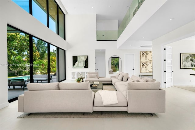 living area with a high ceiling