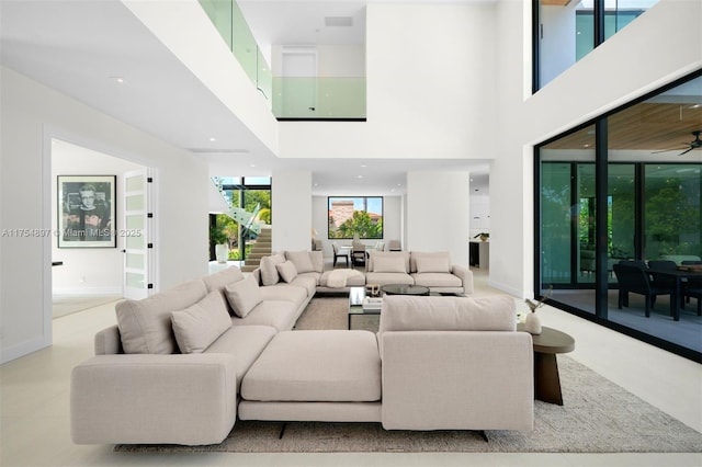 4425 Adams Ave, Miami Beach, FL 33140 - living room with a high ceiling, baseboards, and ceiling fan