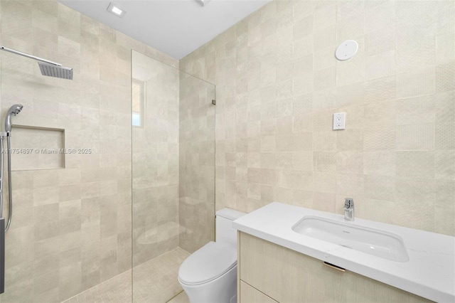 4425 Adams Ave, Miami Beach, FL 33140 - full bath featuring a tile shower, tile walls, toilet, and vanity