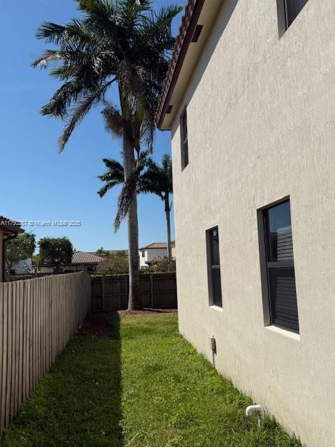 view of yard with a fenced backyard