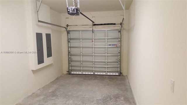 garage featuring electric panel and a garage door opener