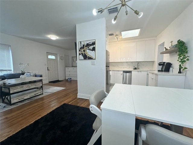 kitchen featuring open shelves, visible vents, decorative backsplash, stainless steel dishwasher, and white cabinets