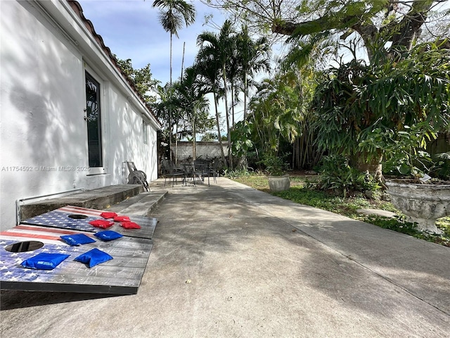 view of patio / terrace featuring fence