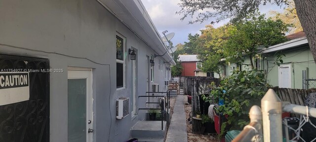 view of home's exterior featuring fence and stucco siding