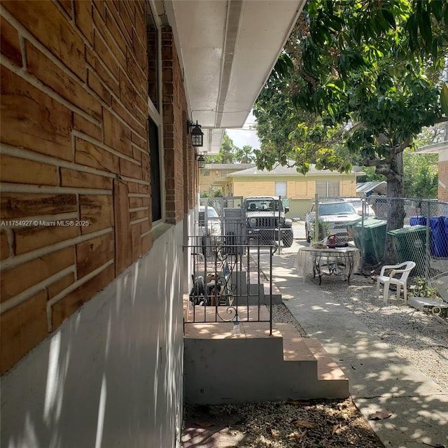 view of patio / terrace featuring fence